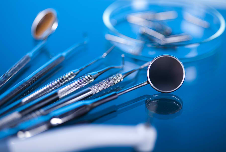 close up of dental tools with blue background | wisdom tooth removal toowoomba