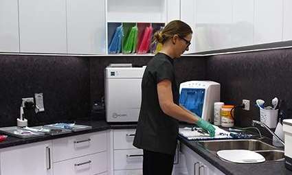dental assistant using dental machines | toowoomba city dentist